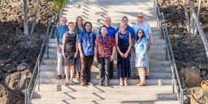Fr. Martin Solma, left, Bro. Ed Brink, center, and Fr. Chris Wittmann congratulate new Marianist Education Associates. They include, from left, Abby Halston, Kahala Kabalis Hoke, Andrew Ancheta, Gail Grabowsky, Rylan Chong and Cheryl Edelson.