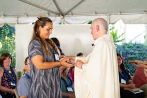 As part of the MEA Formation rituals, Fr. Martin Solma annoints the hands of Kahala Kabalis Hoke.