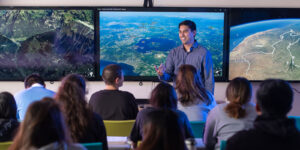 Data Science professor Dr. Rylan Chong lectures on the multiple uses of geospatial intelligence.