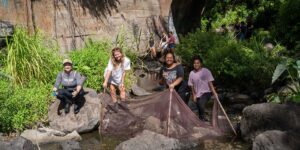 ENV 100 students help clean up the debris in Palolo Stream.