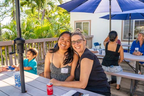 Katrina Roseler, Ph.D., Director of Teacher Preparation Programs and Associate Professor, right, wraps her arm around Sarah Sousa BA '17, MEd '19.