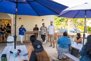 Alumni and faculty gathered for a mini reunion on the patio deck of Brogan Hall.