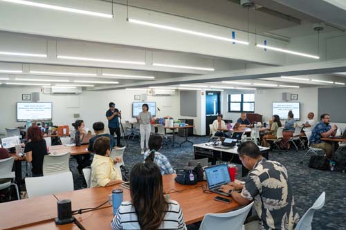 Economics Professor, Dr. Guanlin Gao, discussed the basic fundamentals of economics and its functions in society.