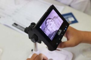 American Samoa students got to use various science equipment, including this mini microscope.