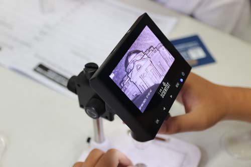 American Samoa students got to use various science equipment, including this mini microscope.