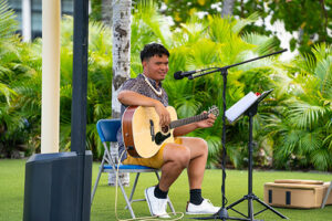 Ulupuhi Pale can often be seen and heard playing his guitar at various campus events.