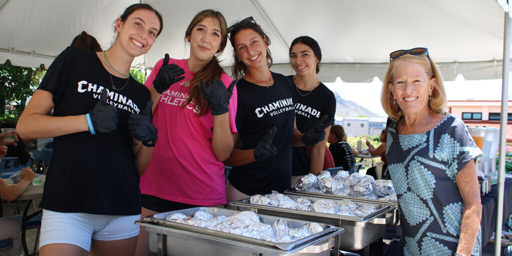 Chaminade President Lynn Babington, Ph.D., welcome back students with a special lunch served by some of the Women's Volleyball.