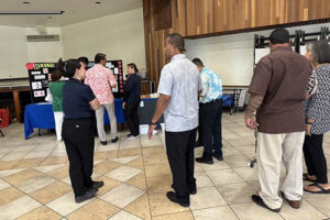 St. John the Baptist Church parishioners wait to get their blood pressure tested during Chaminade's Parish Health Program.