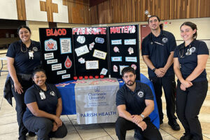 NUR 401 Public Health students visit St. John the Baptist Church in Kalihi as part of Chaminade's Parish Health Program. Pictured are, from left, standing, Victoria Ayala, Nina Jackson, James Kightlinger, Kaulana Navares and Jasmin Clayton.