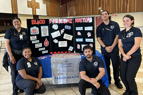 NUR 401 Public Health students visit St. John the Baptist Church in Kalihi as part of Chaminade's Parish Health Program. Pictured are, from left, standing, Victoria Ayala, Nina Jackson, James Kightlinger, Kaulana Navares and Jasmin Clayton.