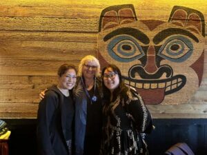 Kizzie Jones '90 is flanked by Chaminade Director of Development Heidi Bow, left, and Advancement Vice President Jill Higashi.