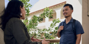 School of Humanities, Arts and Design Dean, Cheryl Edelson, Ph.D., discusses vocational education with senior Kaimipono Abella.