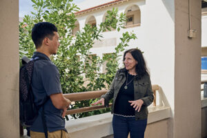 School of Humanities, Arts and Design Dean, Cheryl Edelson, Ph.D., discusses vocational education with senior Kaimipono Abella.
