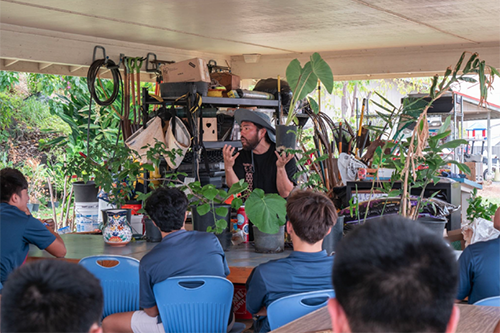 Jon Watase educates St. Louis School's students about environmental issues in his outdoor pavilion classroom.