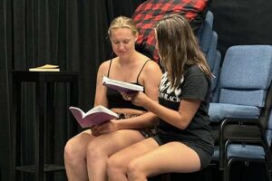 Willow McKay, left, and Jules Mattes read their lines during rehearsal.