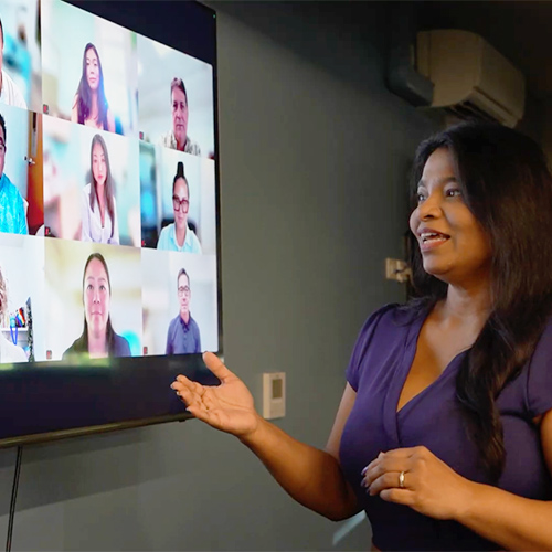 professor talking with her online students